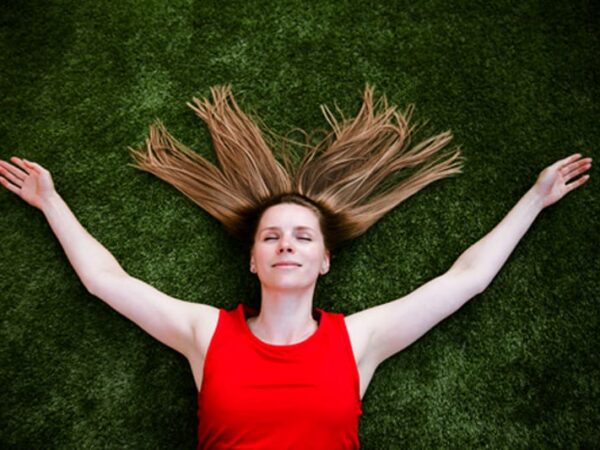 Woman-relaxing-on_the-artificial-grass